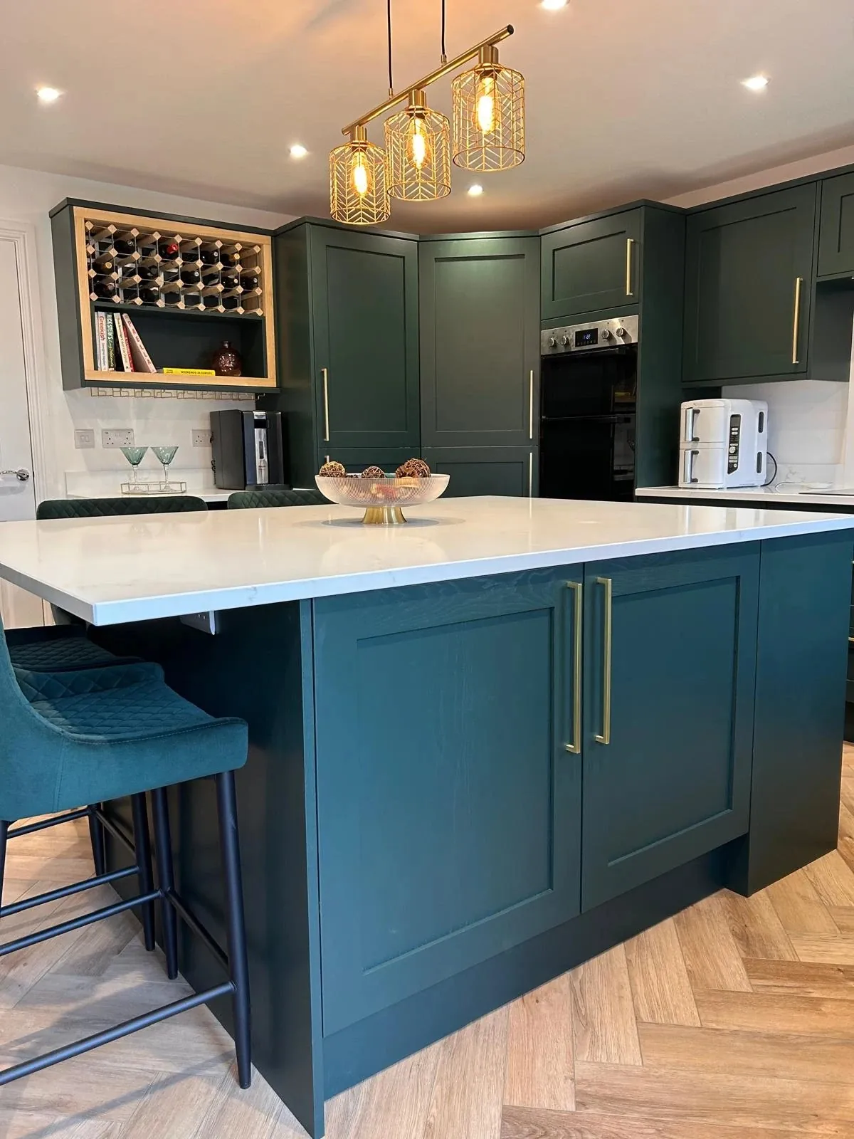 Hunter Green shaker kitchen island with brass handles and quartz worktop in Horbury